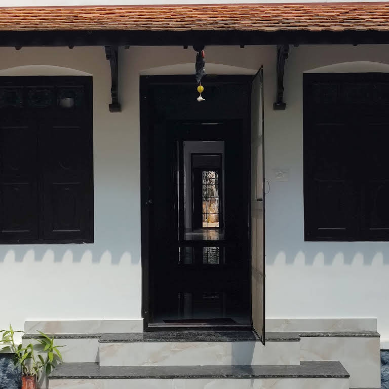 Traditional entrance with carved woodwork