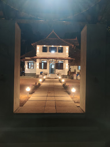 Kottampara House illuminated at night